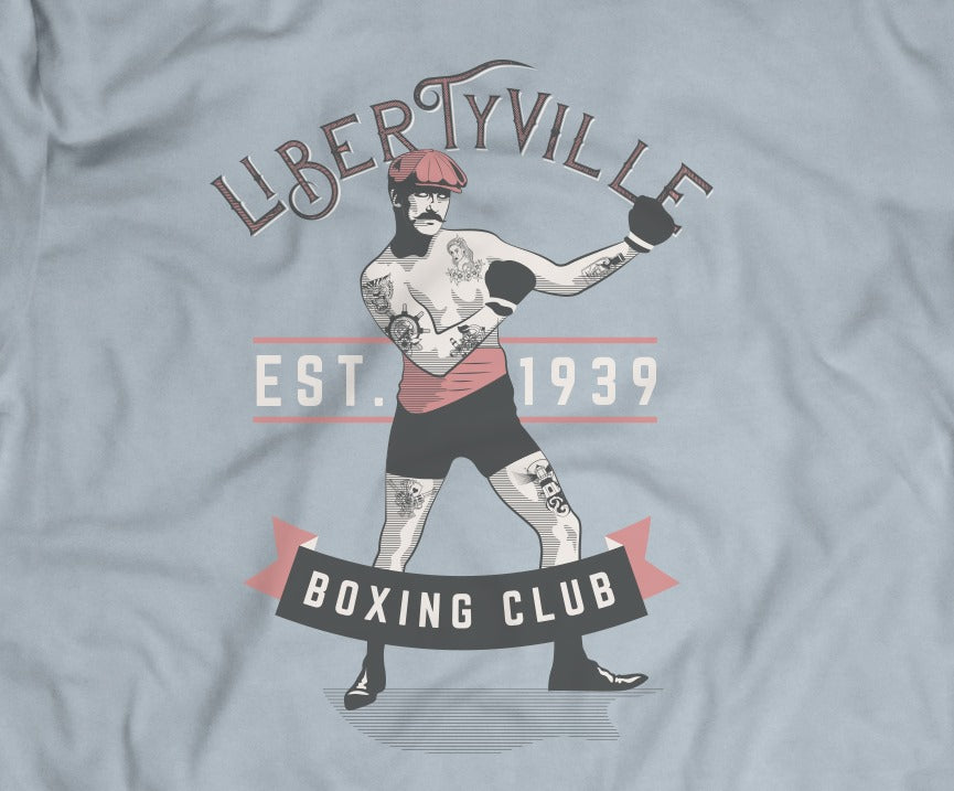 light blue tee with 1930s Libertyville Boxing Club design